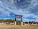 Western Trails Equestrian Park entrance with decorative stone columns and a wood gate at 4530 W Maulding Ave, Las Vegas, NV 89139