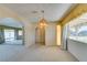 Open dining room with chandelier, archways, and view to the backyard at 4530 W Maulding Ave, Las Vegas, NV 89139