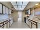 Galley kitchen with tile floor, updated cabinets and laminate countertops at 4530 W Maulding Ave, Las Vegas, NV 89139