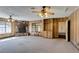 Large open living room with stone fireplace, ceiling fans, and lots of space at 4530 W Maulding Ave, Las Vegas, NV 89139