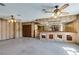 Unique living room with a bar, custom wood paneling, and mirrored accents at 4530 W Maulding Ave, Las Vegas, NV 89139