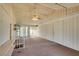 Neutral sun room featuring carpet floor, ceiling fan, and natural light from sliding glass doors at 4530 W Maulding Ave, Las Vegas, NV 89139