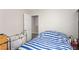 View of a bedroom with a bed, doorway, and storage at 5015 Spencer St # C, Las Vegas, NV 89119