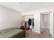 View of a bedroom with a bed, closet full of stored items, and doorway at 5015 Spencer St # C, Las Vegas, NV 89119