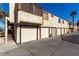 View of garages in complex with exterior stairs at 5015 Spencer St # C, Las Vegas, NV 89119