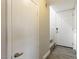 Bright hallway with white doors, wood-look floors, and recessed lighting at 5015 Spencer St # C, Las Vegas, NV 89119