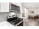Kitchen view featuring stainless steel appliances, modern finishes, and bright lighting at 5015 Spencer St # C, Las Vegas, NV 89119