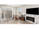 Inviting living room featuring a fireplace and sliding glass doors to the outside at 5015 Spencer St # C, Las Vegas, NV 89119