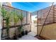 Back patio area with privacy screen, pavers, and some plants at 5015 Spencer St # C, Las Vegas, NV 89119
