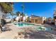 Outdoor community pool with hot tub on a sunny day, fenced off, surrounded by desert landscaping at 5015 Spencer St # C, Las Vegas, NV 89119