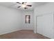 Bedroom with ceiling fan, double closet, neutral carpet and window for natural light at 5265 Lucca Ln, Pahrump, NV 89061