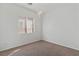 Bedroom with a chandelier, carpet flooring, and a bright window at 5265 Lucca Ln, Pahrump, NV 89061