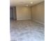 Spacious open-concept living area featuring recessed lighting and neutral tiling at 5392 Blustery Towns Ave, Las Vegas, NV 89118
