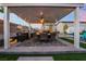 Outdoor kitchen with granite counters, grill, and covered dining space featuring a ceiling fan at 5865 Alice Landing Ct, Las Vegas, NV 89149