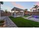 An outdoor seating area with comfortable sofas and chairs adjacent to the pool and patio at 5865 Alice Landing Ct, Las Vegas, NV 89149