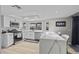 Modern kitchen featuring stainless steel appliances, quartz countertops, and a breakfast bar at 638 Paloma Dr, Boulder City, NV 89005