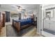 Main bedroom featuring a wood frame bed, dresser, wood-look floors, and neutral colored walls at 638 Paloma Dr, Boulder City, NV 89005