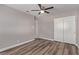 This bedroom features modern flooring, closet with sliding doors, and neutral decor at 6412 Miragrande Dr, Las Vegas, NV 89108