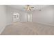 Spacious bedroom with neutral carpet, ceiling fan and ensuite bathroom access at 6704 Indian Chief Dr # 101, Las Vegas, NV 89130