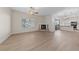 Bright, open living room features a fireplace, ceiling fan, and sliding doors to outdoor space at 6704 Indian Chief Dr # 101, Las Vegas, NV 89130