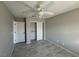 Bedroom featuring a ceiling fan and neutral walls, with a double door closet at 70 Moonlight Village Ln, Henderson, NV 89012