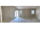 Spacious primary bedroom with wood tile, neutral walls, plantation shutters, and access to backyard at 70 Moonlight Village Ln, Henderson, NV 89012