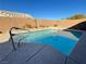Refreshing swimming pool with decorative dolphin mosaic, perfect for relaxation and recreation at 70 Moonlight Village Ln, Henderson, NV 89012