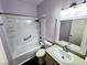 Bathroom featuring a shower-tub combo with a large mirror, vanity, and tile flooring at 7231 Indian Creek Ln # 204, Las Vegas, NV 89149