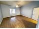 Bright bedroom with light blue walls, ceiling fan and shuttered window at 7231 Indian Creek Ln # 204, Las Vegas, NV 89149