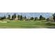 Scenic view of the community golf course with rolling greens and mountain views at 7231 Indian Creek Ln # 204, Las Vegas, NV 89149