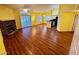 Sun-filled living room with wood floors, fireplace, and sliding glass doors at 7231 Indian Creek Ln # 204, Las Vegas, NV 89149