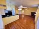 Inviting living room features wood floors, a breakfast bar and lots of light at 7231 Indian Creek Ln # 204, Las Vegas, NV 89149