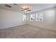 Bedroom with multiple windows and a ceiling fan, offering plenty of natural light and air flow at 7735 Sugarloaf Peak St, Las Vegas, NV 89166