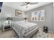 Bedroom showcasing a plush bed, a window with shutters, and soft gray walls at 8220 Flowing Rapids Ct, Las Vegas, NV 89131