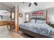 Cozy main bedroom with a unique bedframe, light wood floors, and plenty of natural light at 8220 Flowing Rapids Ct, Las Vegas, NV 89131