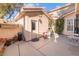 Private backyard with a door to the main house and a small patio area at 8225 Taos Paseo Ave, Las Vegas, NV 89128