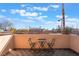 Charming balcony with seating area offering neighborhood views and blue skies at 8225 Taos Paseo Ave, Las Vegas, NV 89128