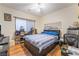 Bedroom with hardwood floors, ceiling fan, and furniture at 8225 Taos Paseo Ave, Las Vegas, NV 89128
