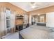 Comfortable bedroom featuring a large window, closet with mirror door and soft natural light at 8225 Taos Paseo Ave, Las Vegas, NV 89128