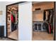 Organized walk-in closet featuring shelves, hanging racks, and ample storage space at 8225 Taos Paseo Ave, Las Vegas, NV 89128