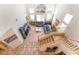 Bright living room with high ceilings, large windows, and staircase with wood floors at 8225 Taos Paseo Ave, Las Vegas, NV 89128