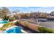 View of the sparkling swimming pool with the home's well-maintained landscaping in the background at 8225 Taos Paseo Ave, Las Vegas, NV 89128