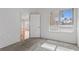 Light-filled bedroom with carpet features a view from the large bright window at 8805 Jeffreys St # 2002, Las Vegas, NV 89123