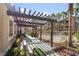 Community pergola provides shade for walking along the grounds at 8805 Jeffreys St # 2002, Las Vegas, NV 89123