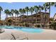 Enjoy the community pool surrounded by palm trees and meticulously kept landscaping at 8805 Jeffreys St # 2002, Las Vegas, NV 89123