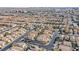 Expansive aerial shot showing a residential area with tightly packed houses and street views at 9563 Grapeland Ave, Las Vegas, NV 89148