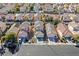 Aerial view of a residential neighborhood featuring homes with solar panels on roofs at 9563 Grapeland Ave, Las Vegas, NV 89148