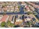 Overhead view of a neighborhood with homes, mature trees, and solar panels on roofs at 9563 Grapeland Ave, Las Vegas, NV 89148