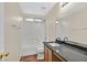Bathroom featuring shower-tub combination and vanity with granite countertop at 9563 Grapeland Ave, Las Vegas, NV 89148