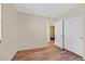 Bedroom featuring wood-look floors, a closet, and a view to another room at 9563 Grapeland Ave, Las Vegas, NV 89148